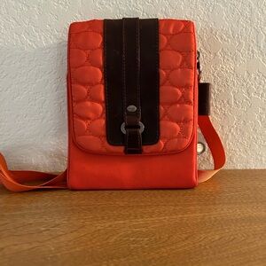 Mosey travel crossbody quilted front sturdy zippers multiple pockets and slots.
